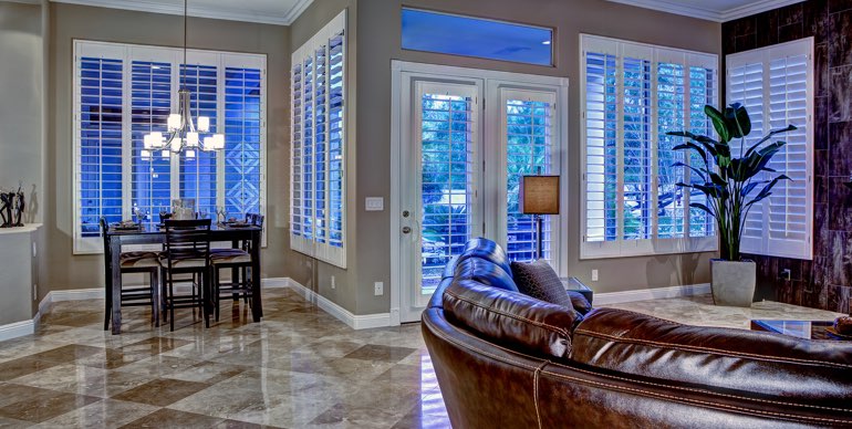 Atlanta great room with classic shutters and tile floor.
